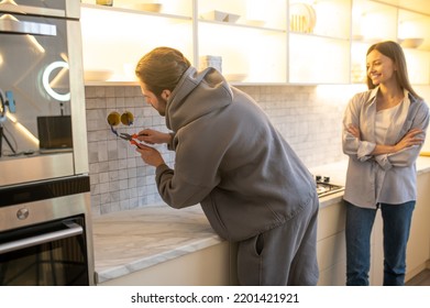 Experienced Serviceman Installing The Outlet On The Kitchen Wall