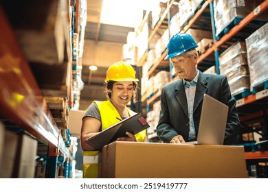 Experienced supervisor guiding young worker with clipboard in warehouse stock management - Powered by Shutterstock