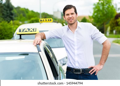 Experienced taxi driver in front of his taxi, waiting for a passenger