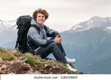 experienced traveler with rucksack looking at the camera outdoors. close0up photo