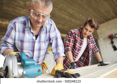 Experienced Worker Clamped The Wood