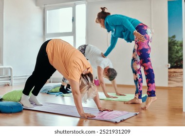 Experienced yoga instructor demonstrating safe and effective exercises for seniors to improve flexibility and balance.
