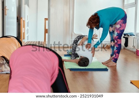 Experienced yoga instructor demonstrating safe and effective exercises for seniors to improve flexibility and balance.