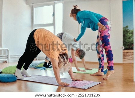 Experienced yoga instructor demonstrating safe and effective exercises for seniors to improve flexibility and balance.