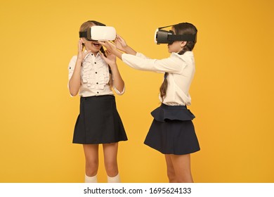 Experiences communicate and manage projects.Kids use modern VR technology. Virtual reality. VR headset. Future education. Children schoolgirls wear wireless VR glasses. Exploring augmented reality.