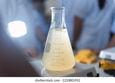 Experiment chemical solution mixing liquids on a Hotplate Stirrer in Lab.
Scientists are boiling and stirring chemicals on the machine hotplate stirrer. In the chemistry laboratory. Close up image.