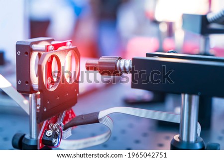 Experiment with laser device in optical laboratory