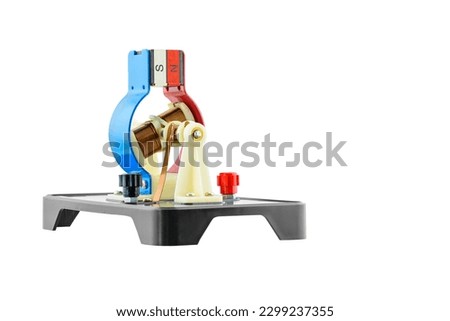 Experimental electric DC generator isolated on white, consists of copper coils and magnets. A generator is a device that converts mechanical energy to electrical energy for use in an external circuit.