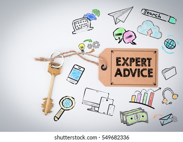 Expert Advice. Key and a note on a white background 