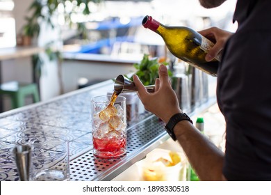 Expert Barman is Making Cocktail at Beach Bar