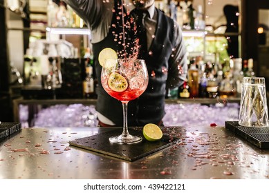 Expert barman is making cocktail at night club. - Shutterstock ID 439422121