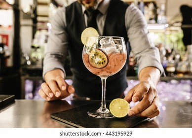 Expert barman is making cocktail at night club. - Shutterstock ID 443195929