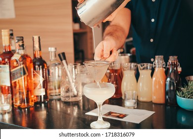 The Expert Bartender Is Making A Cocktail At The Home Party. Man Preparing Cocktails.