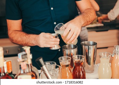 The Expert Bartender Is Making A Cocktail At The Home Party. Man Preparing Cocktails.