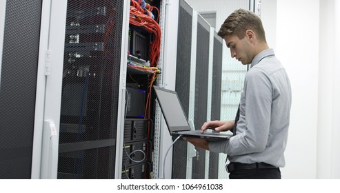 IT expert checking supercomputer server