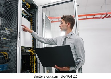 IT expert checking supercomputer server