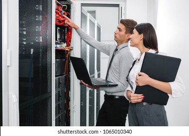 IT expert checking supercomputer server