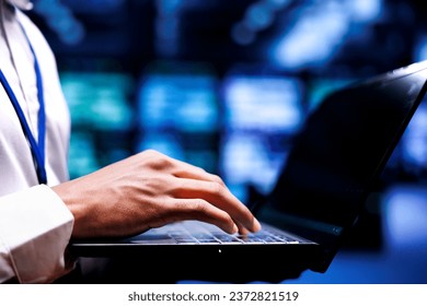 Expert servicing server rows with high computing power enabling hyperscale data center to support demanding applications, including artificial intelligence and neural network workloads