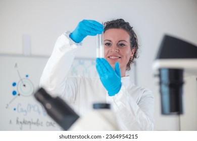 An expert using test tubes for analysis milk quality in a laboratory
