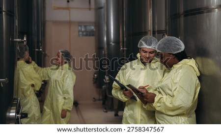 An Expert Vintner Overseeing the Systematic Fermentation Process and Liquor Distillation Quality within an Advanced Vertical Manufacturing Plant.