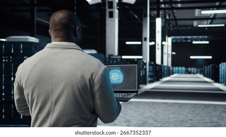 IT expert walking in server hub using laptop to enhance AI model accuracy. Data center technician using notebook to schedule routine maintenance for AI hardware components, camera A