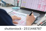 Expert woman asian female people review data number costing managerial account prepare monthly actual cost variance report at tax audit office. ESG sheet budget control ERP process service project.