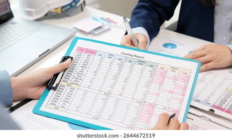 Expert woman asian people discuss review data number costing managerial account prepare monthly actual cost variance report income tax at audit office. ESG budget control ERP process service project.