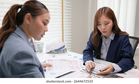 Expert woman asian people discuss review data number costing managerial account prepare monthly actual cost variance report income tax at audit office. ESG budget control ERP process service project.