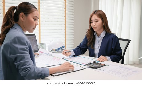 Expert woman asian people discuss review data number costing managerial account prepare monthly actual cost variance report income tax at audit office. ESG budget control ERP process service project.
