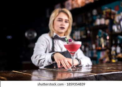 Expert Woman Mixologist Demonstrates The Process Of Making A Cocktail Behind Bar