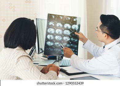 Expertise cancer doctor advising doctor for cure the patient in the in office.