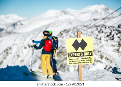 A Experts Only Sign Indicating A Double Black Diamond Run On The Top Of Blackcomb Mountain.