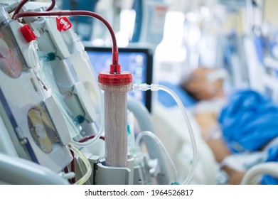 Experts are preparing a dialysis machine for use in critically ill patients in hospital intensive care units.