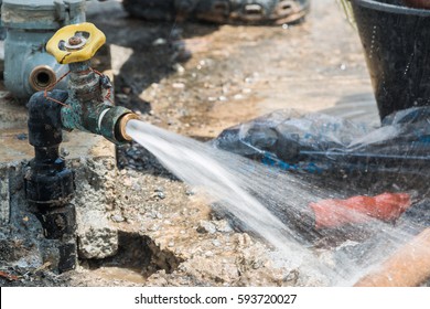 Experts valve repair water pipes, repairing outdoor. - Shutterstock ID 593720027
