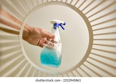 Expired detergent is thrown into the trash for disposal and recycling. View from below. The concept of utilization and processing of waste. - Shutterstock ID 2252945861