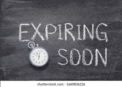 expiring soon phrase written on chalkboard with vintage precise stopwatch