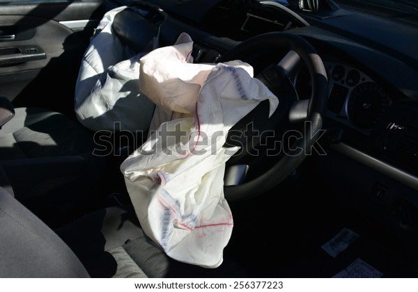 An exploded\
drivers air bag in a car\
accident