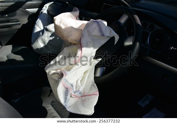 An exploded\
drivers air bag in a car\
accident