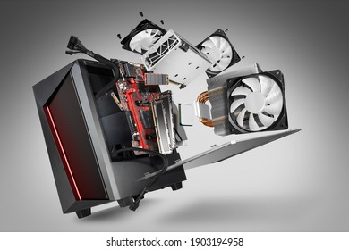 exploded view of a modern computer. hardware components mainboard cpu processor graphic card RAM cables and cooling fan flying out of black red PC case on gray abstract technology concept background