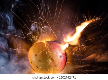 Exploding Apple With Flame, Sparks And Smoke