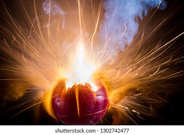 Exploding Apple With Flame, Sparks And Smoke