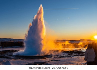 exploding gysir at sunset in iceland 