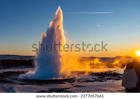 exploding gysir at sunset in iceland 