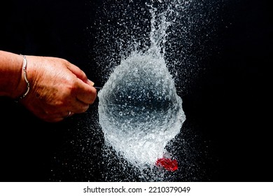 Exploding Water Balloon. High Speed Photography.