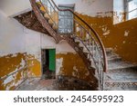 Exploration of the historic old stone mill with a spiral staircase in Southern Poland, Europe, in Winter