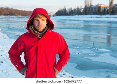 Exploration of polar regions. Winter destinations. Winter fishing. Safety measures. Polar explorer. Winter menswear. Winter outfit. Comfortable outfit. Man warm jacket snowy nature background. - Powered by Shutterstock