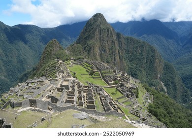 Explore the ancient ruins of Machu Picchu in Peru surrounded by breathtaking mountains and blue skies during the daytime - Powered by Shutterstock