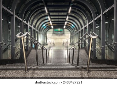 Explore the Architectural Elegance: Staircase Descent at the Entrance to a Vibrant Railway Station and Platform Scene. Descending Perspectives.. a captivating view down.