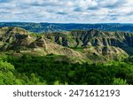 Explore the breathtaking natural beauty of the majestic green canyon landscape with rugged terrain, lush greenery, and stunning panoramic views, Little Missouri State Park, North Dakota