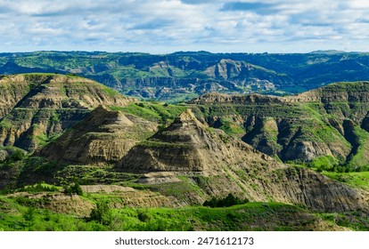 Explore the breathtaking natural beauty of the majestic green canyon landscape with rugged terrain, lush greenery, and stunning panoramic views, Little Missouri State Park, North Dakota - Powered by Shutterstock